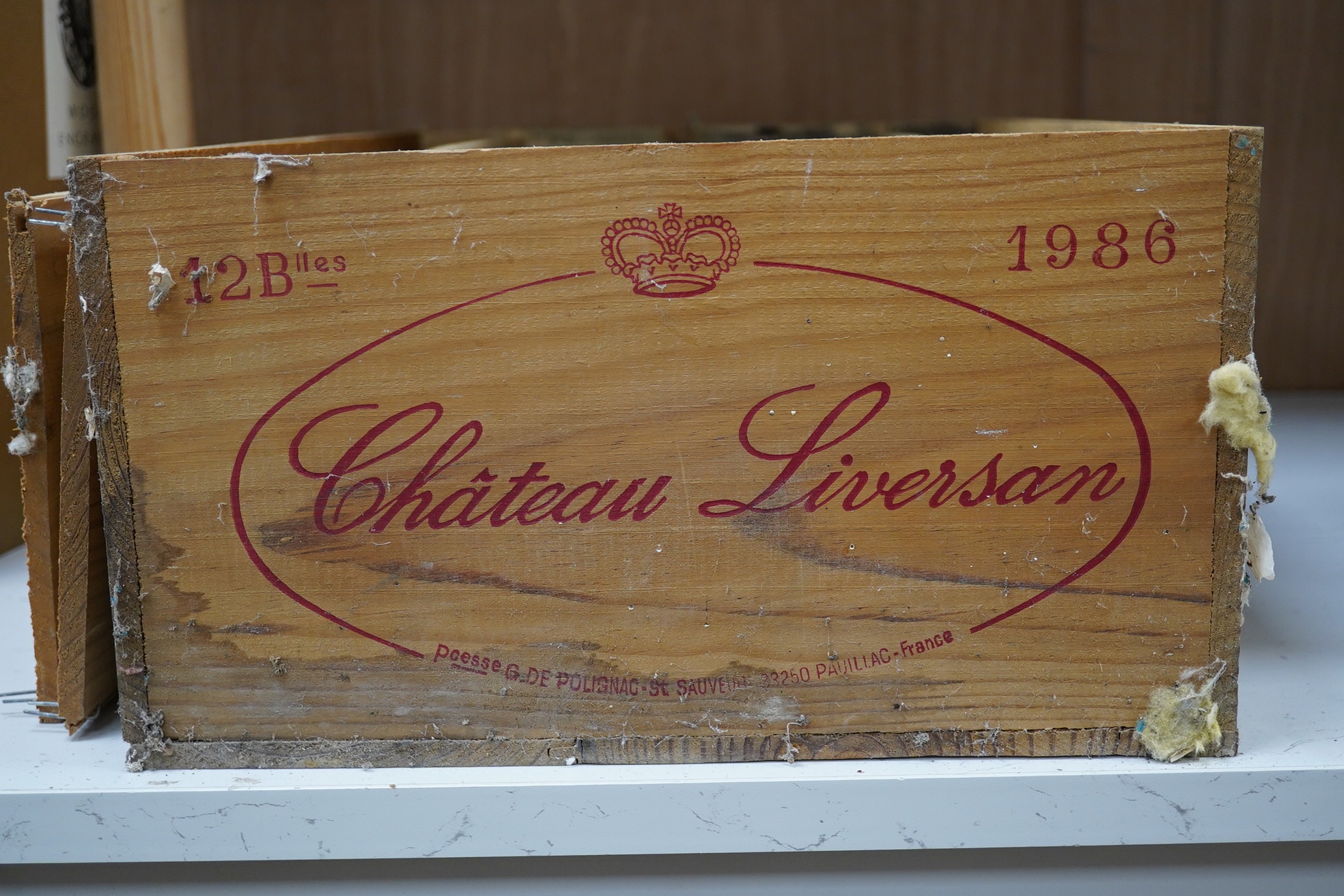 A wooden case of twelve bottles of Chateau Liversan Haut-Medoc 1986 red wine. Condition - good, storage history unknown